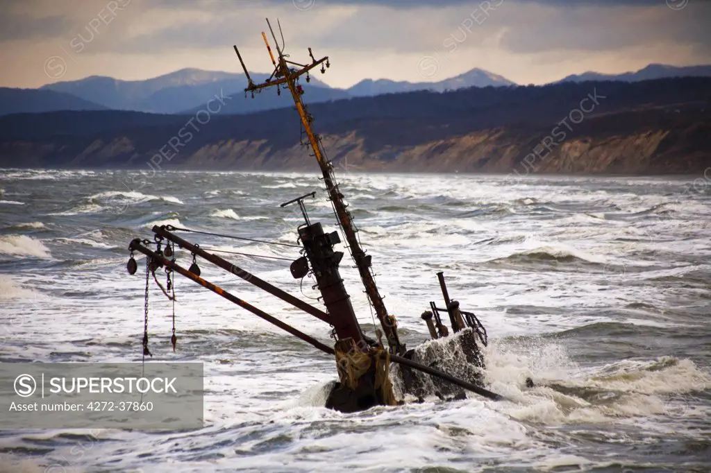 Sakhalin, Alexandrovsk-Sakhalin, Russia; A wreck of a ship in a storm outside the former capital of the island, Alexandrovsk-Sakhalin, where the ship carrying A.P. Chekov entered in 1889