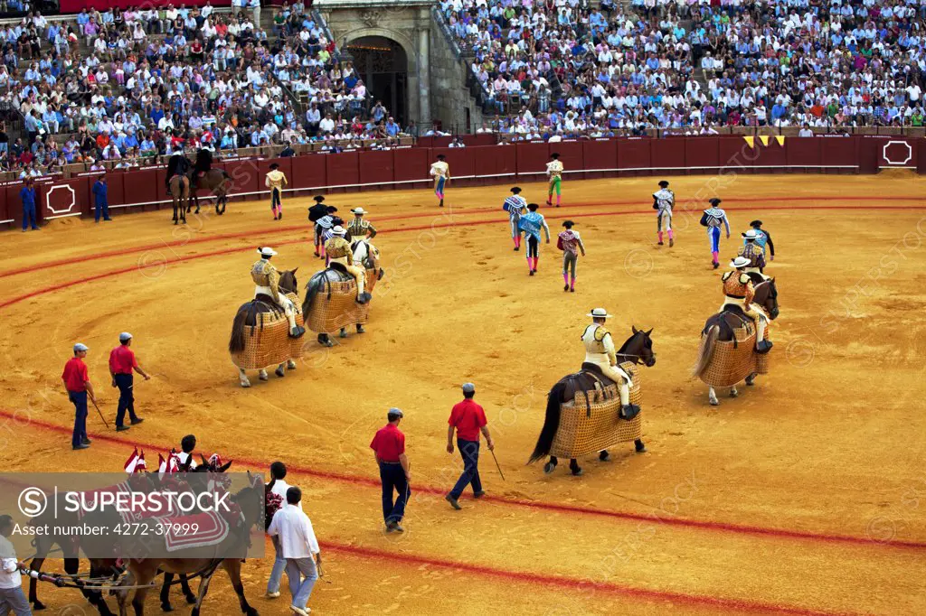 Spain, Andalusia, Seville; The participants of a bull-fight presenting themselves in the arena
