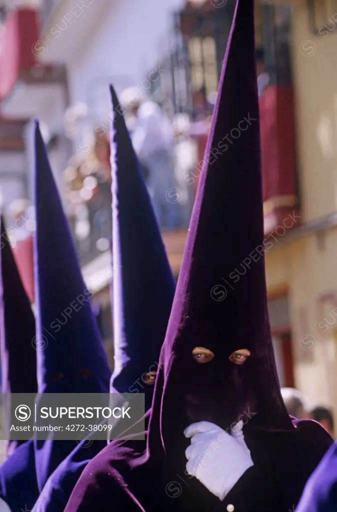 Spain, Andalusia, Seville. Nazarenos during Semana Santa processions