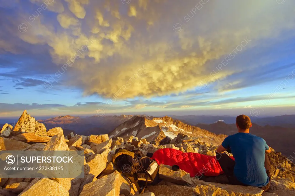 Europe, Spain, Pyrenees, Pico de Aneto  (3404m), highest peak in mainland spain, climber looking at sunrise view MR