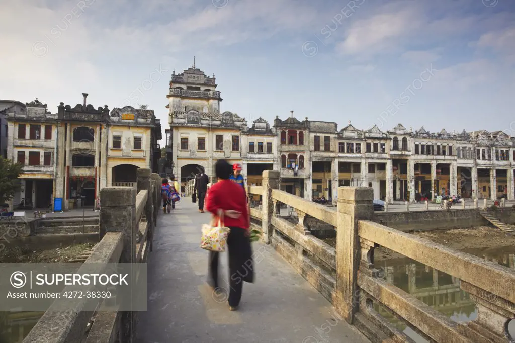 People crossing bridge in front of colonial architecture, Chikanzhen, Guangdong, Guangdong, China