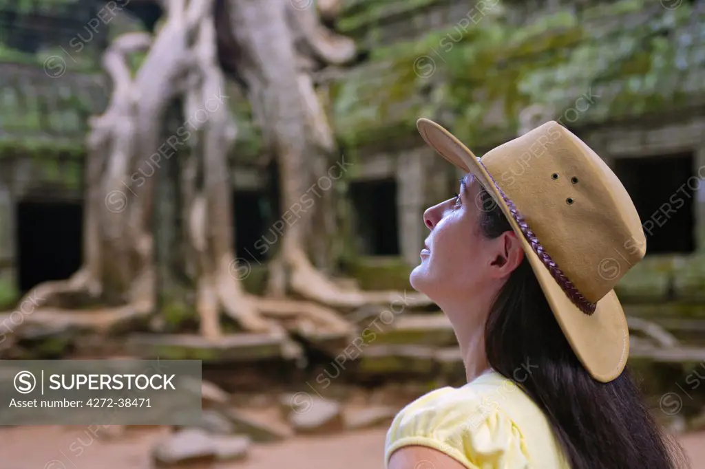 Cambodia, Angkor, Siem Reap, Ta Prohm Temple, Woman exploring MR