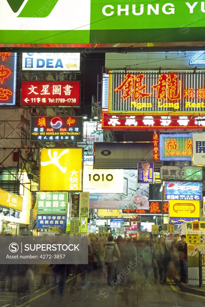 Shoppers descend on the neon lit streets of the Yau Ma Tei district in Kowloon, Hong Kong