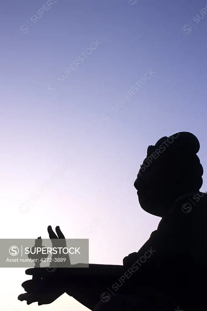 Statue of a Bodhisattva - one of six ringing the giant Tian Tan Buddha at Ngong Ping on Lantau Island, Hong Kong.