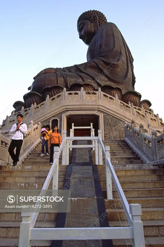 Tourists descend the 260 steps leading to the giant Tian Tan Buddha at Ngong Ping on Lantau Island, Hong Kong. At 34 metres high and 202 tonnes, the bronze statue is the worlds largest of its kind in the world.