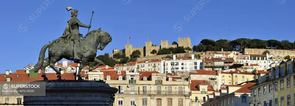 The historical centre and the Sao Jorge castle, with King Dom Joao I equestrian statue. Lisbon, Portugal