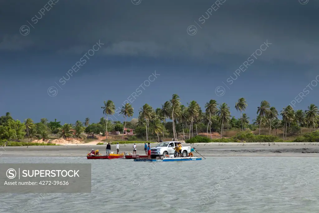 South America, Brazil, Ceara, Camocim, storm clouds over the ferry rafts at Guriu near Jericoacoara