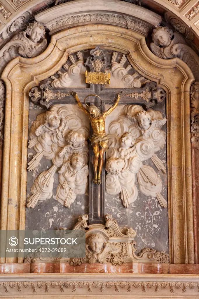 Brazil, Bahia, Salvador, a rococo crucifix in the chapel of the Convento do Carmo hotel in Salvador