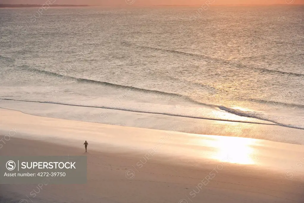 South America, Brazil, Ceara, Jericoacoara, jogger at peace on the beach at sunset seen from the Sunset dune