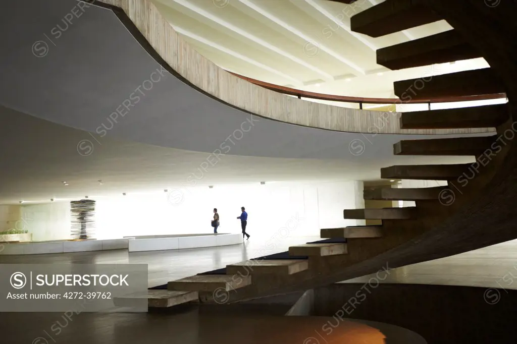South America, Brazil, Brasilia, Distrito Federal, Interior of Oscar Niemeyers Palacio de Itamaraty in Brasilia, showing the concrete spiral staircase