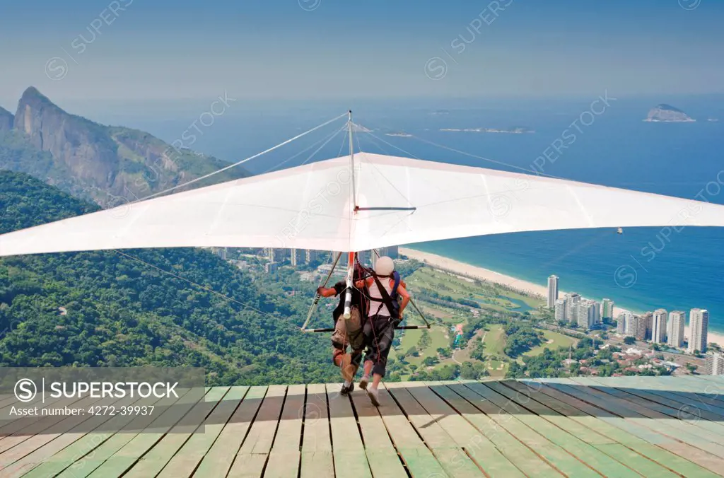 Brazil, Rio de Janeiro state, Rio de Janeiro city, Hang gliding from the Pedra Bonita in Tijuca National Park, Parque Nacional da Tijuca,