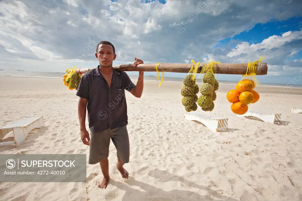 South America, Brazil, Maranhao, Sao Luis, Sao Marcos beach, fruit vendor selling custard apples and oranges