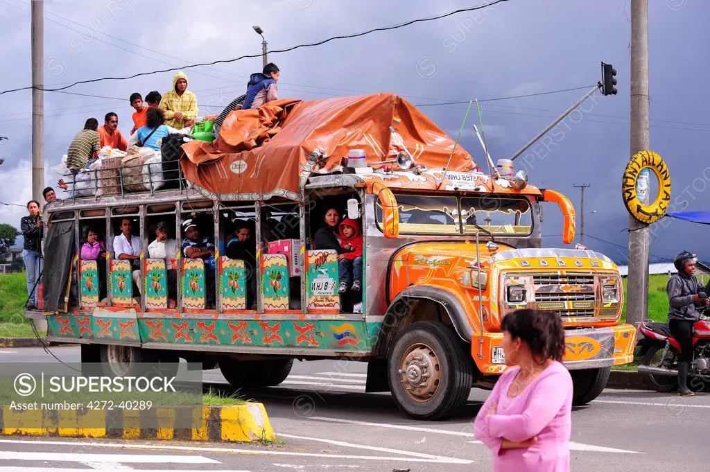 Overloaded bus on the Panamericana Highway, near Popayan, Colombia, South America