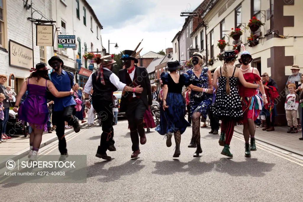 Southwell, England. A modern Morris side dances in the street as part of the Southwell gate Morris festival.