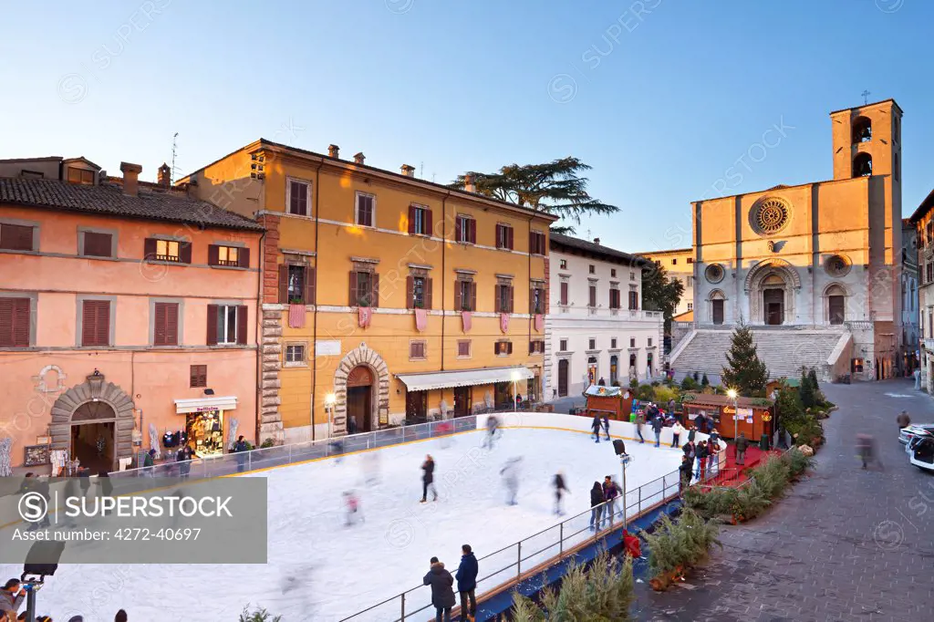 Italy, Umbria, Perugia district, Todi. Ice skating in Piazza del Popolo.