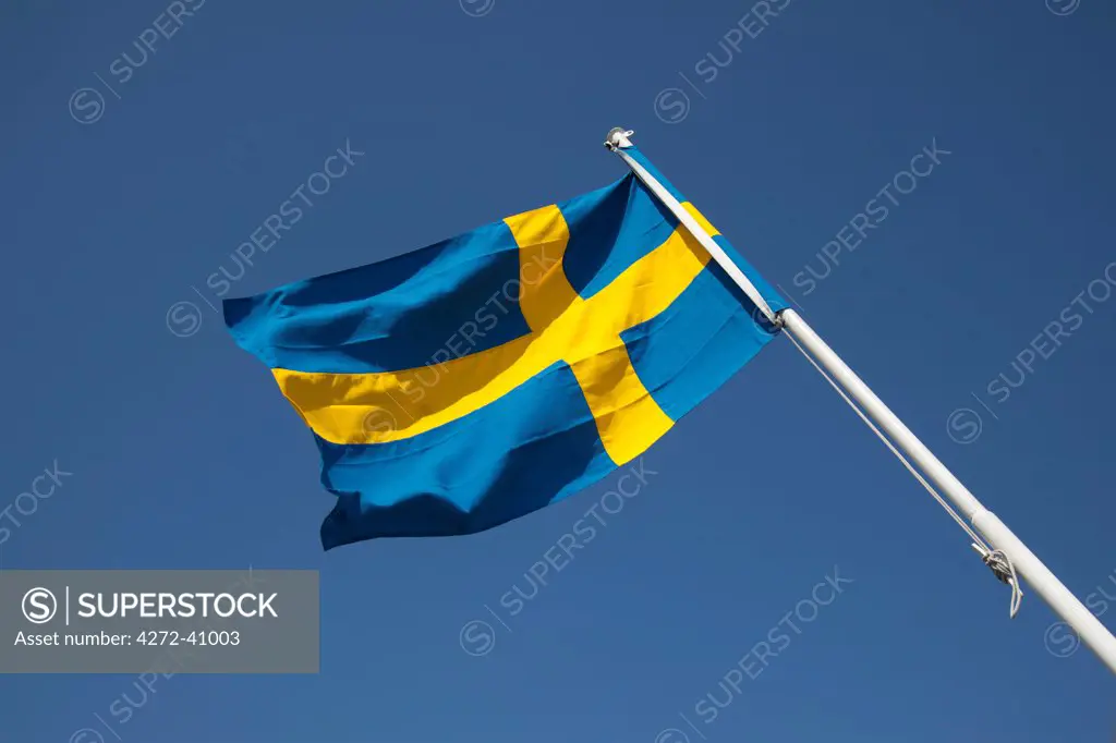 Gothenburg, Sweden. The Swedish national flag flies from the back of a city ferry.