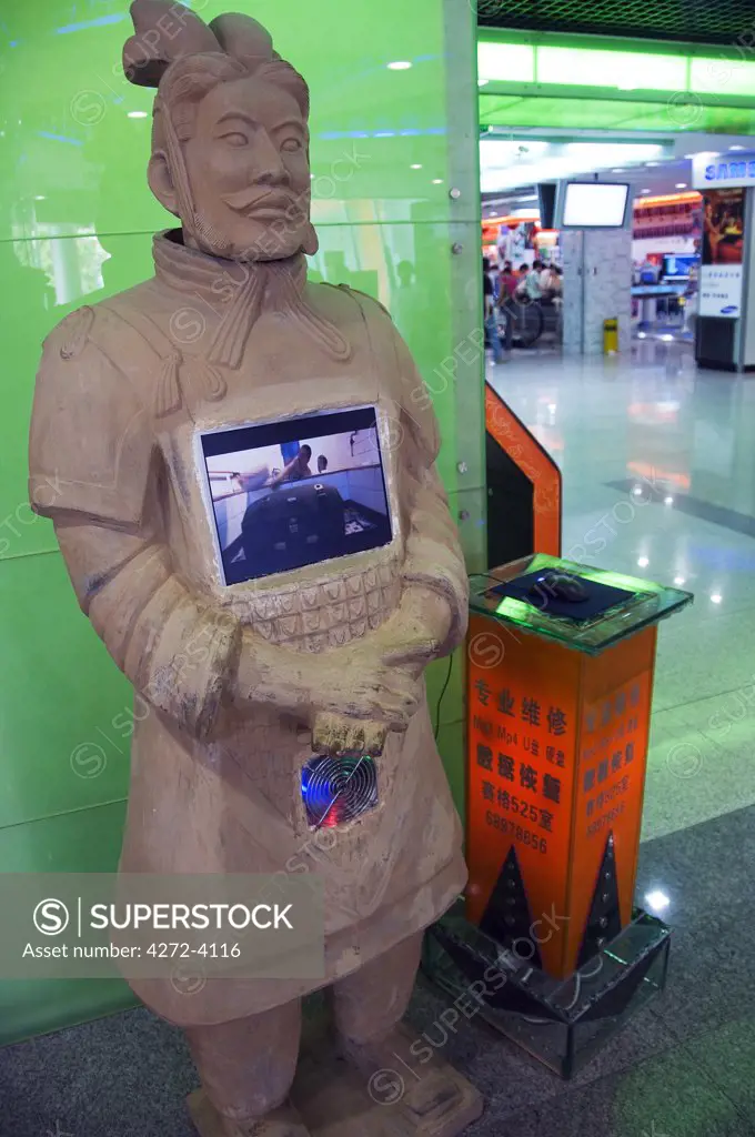 A modern terracotta warrior displayed in a city centre shopping mall, Xian City, Shaanxi Province, China