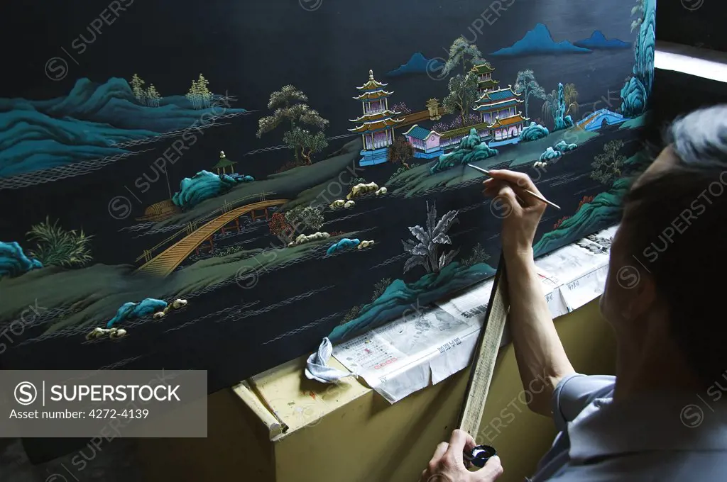 A local craftsmen painting at a museum in Pingyao City, Shaanxi Province, China