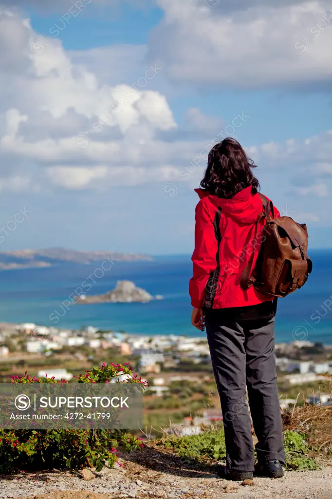 Greece, Kos, Southern Europe. A tourist looking at the view from Kefalos. MR