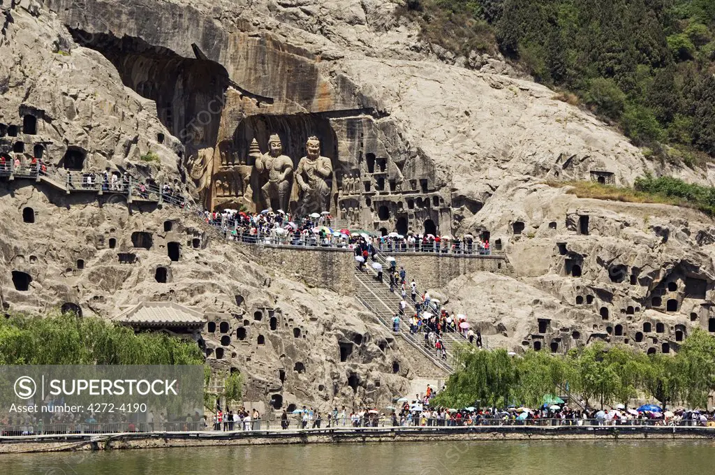 Carved Buddha images at Longmen Caves, Dragon Gate Grottoes on the Yi He River, Henan Province, China