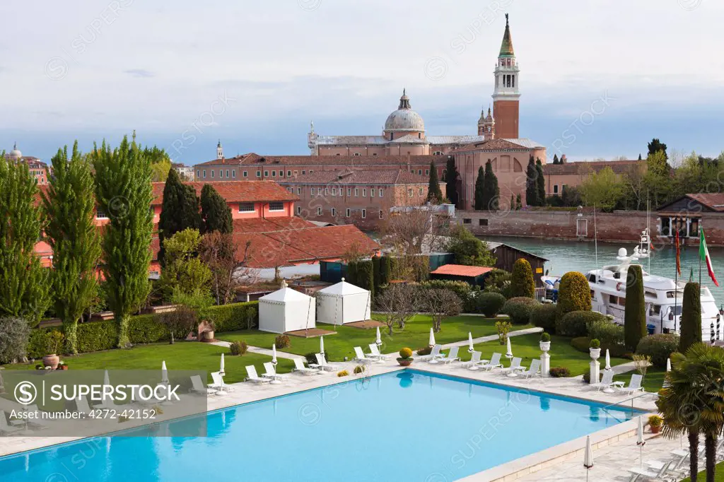 The swimming pool at the Hotel Cipriani in Venice, with the Church of San Giorgio Maggiore in the background, Italy