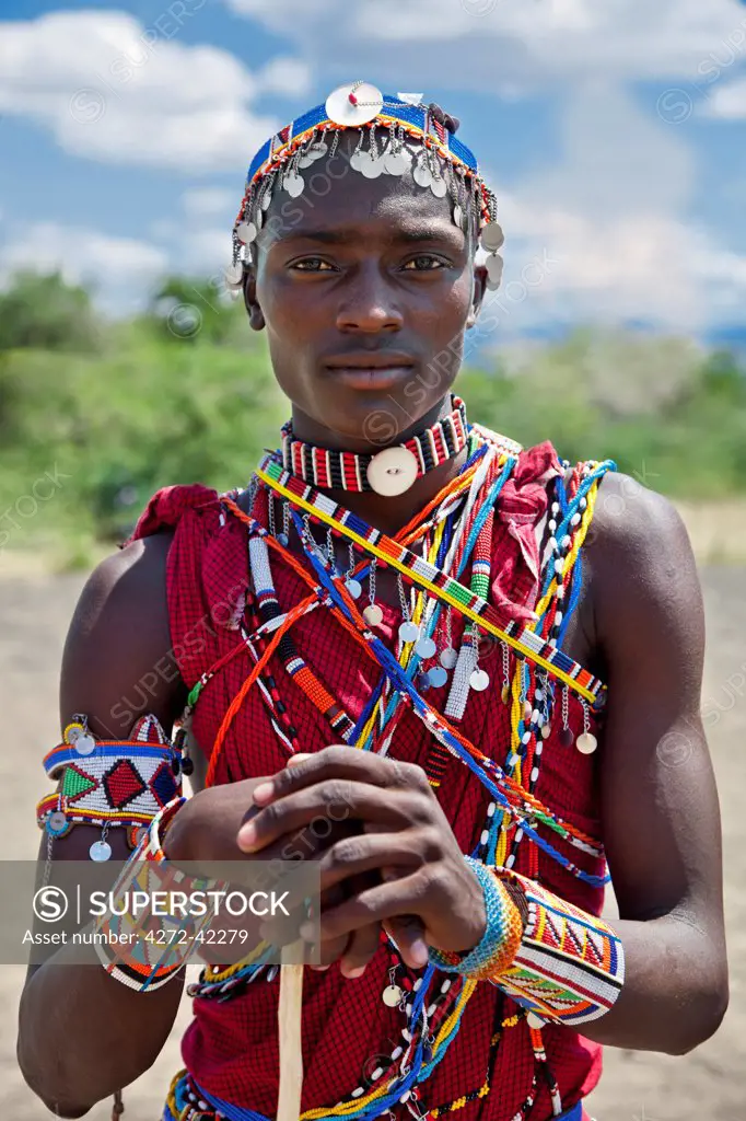 A Maasai schoollboy in traditional attire during an inter schools song and dance competition, Kenya