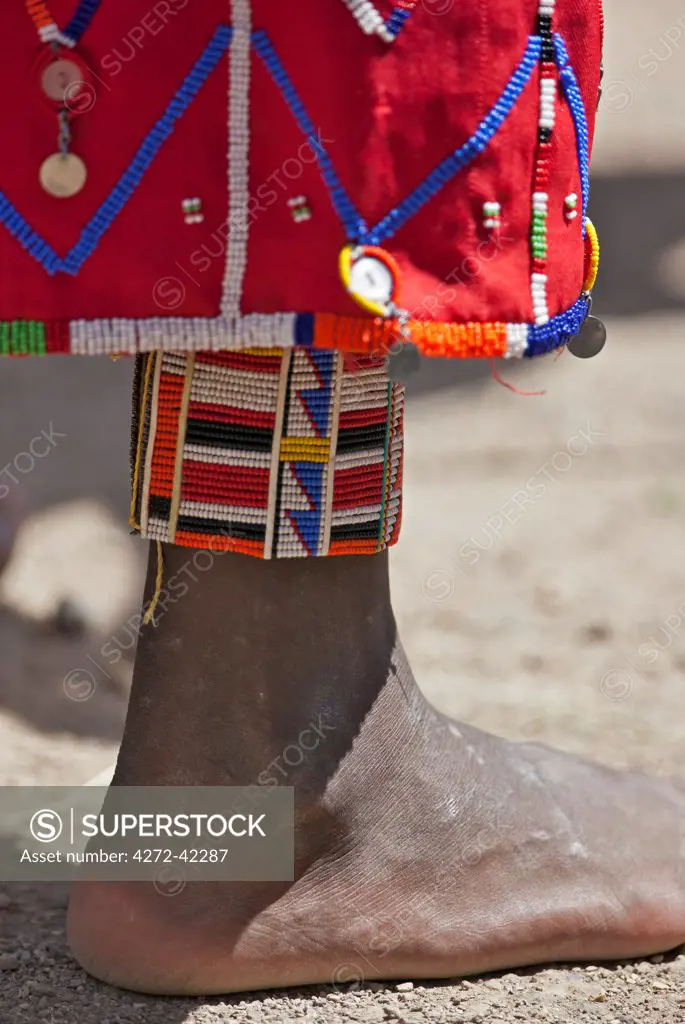 The colourful beaded anklets and decorated skirt of a Maasai woman at Magadi, Kenya