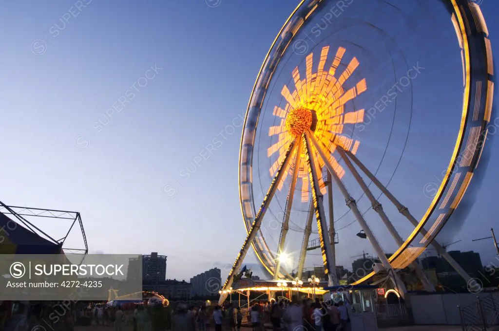 China, Shandong Province, Qingdao City. Amusement park's big wheel at the Qingdao International Beer Festival. Qingdao is the host of the sailing events of the 2008 Olympic Games.