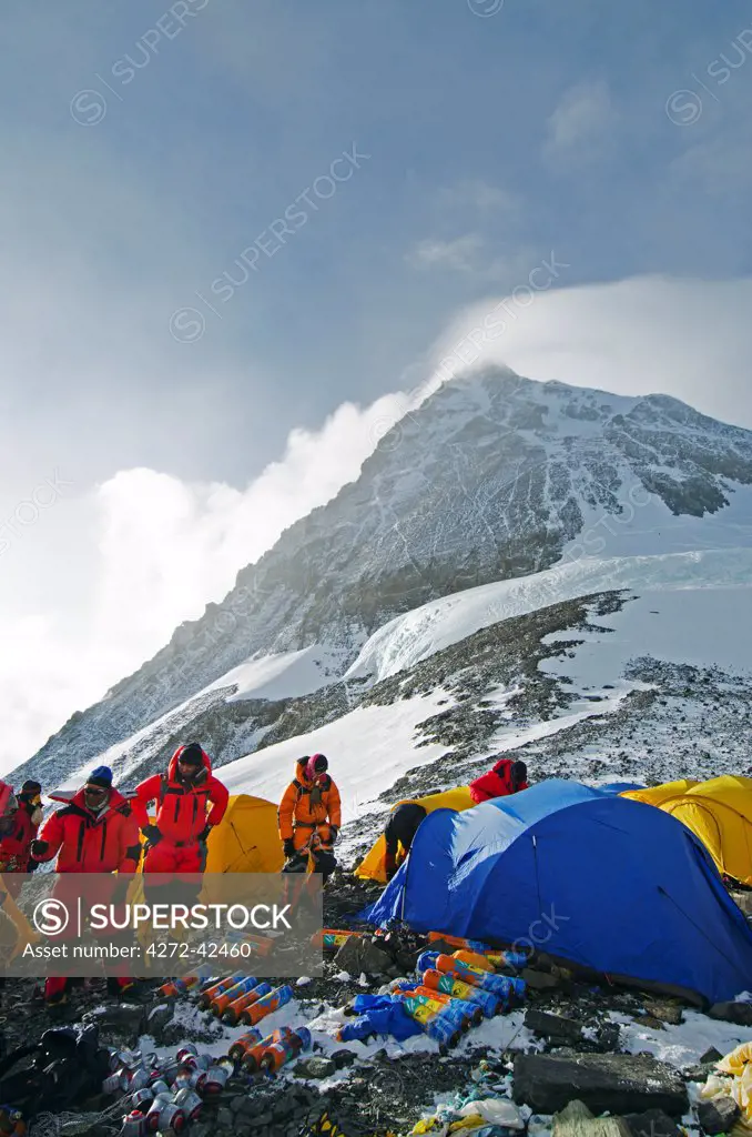 Asia, Nepal, Himalayas, Sagarmatha National Park, Solu Khumbu Everest Region, Sherpa checking oxygen at the South Col, 8000m, Mt Everest South Summit above