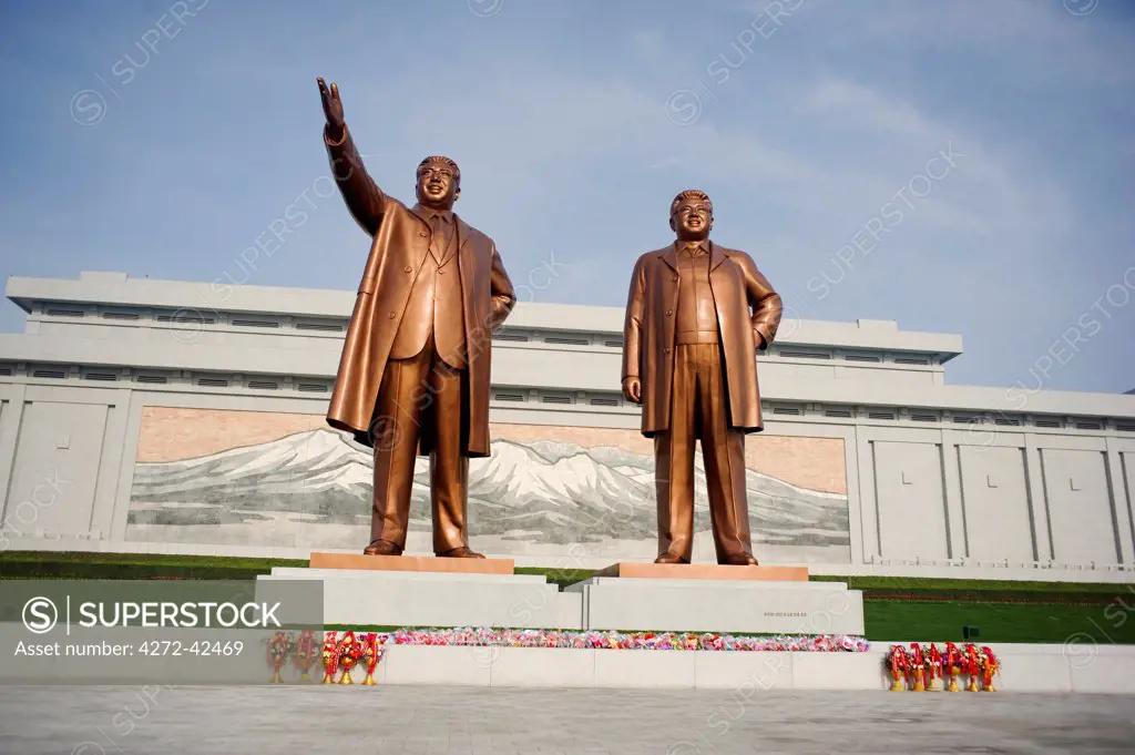 North Korea, Pyongyang. Kim Il Sung and Kim Jong Il Grand Monument in Pyongyang, Kim Jong Il statue has recently been added since his death