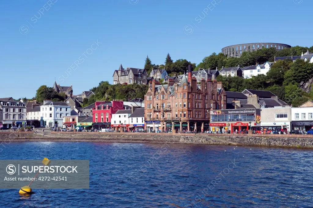 Scotland, West Coast, Oban. View of Oban harbour with McCaig's folly on the hill behind.