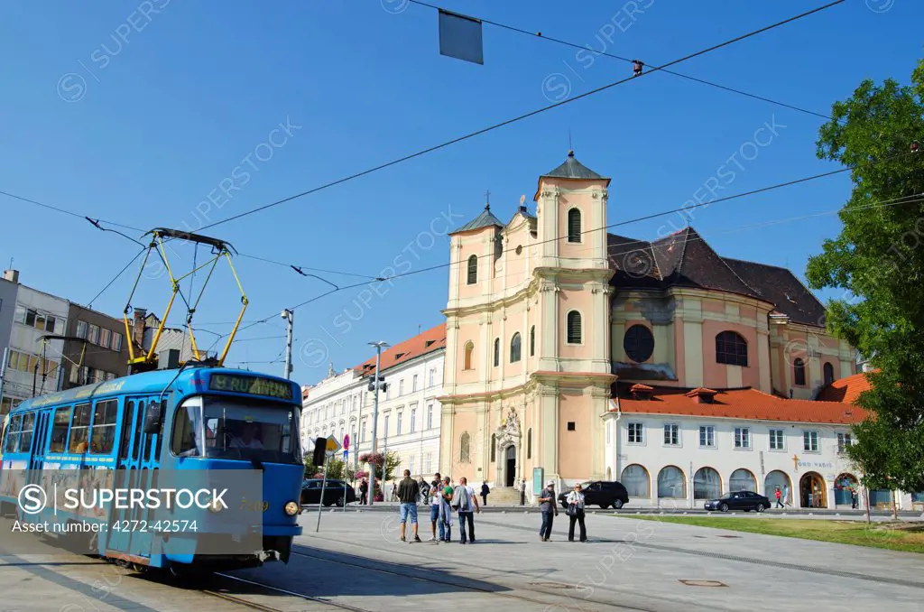 Europe, Slovakia, Bratislava, street tram and Holy Trinity baroque style church