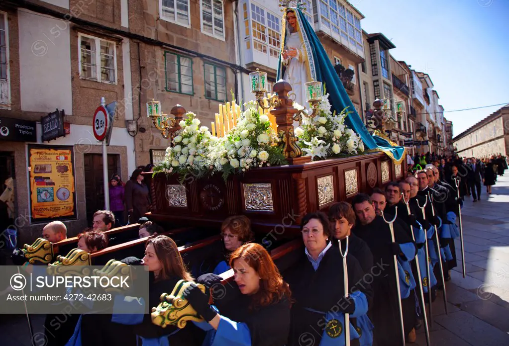 Santiago de Compostela, Galicia, Northern Spain, Participants of Easter procession carrying a statue from the city centre