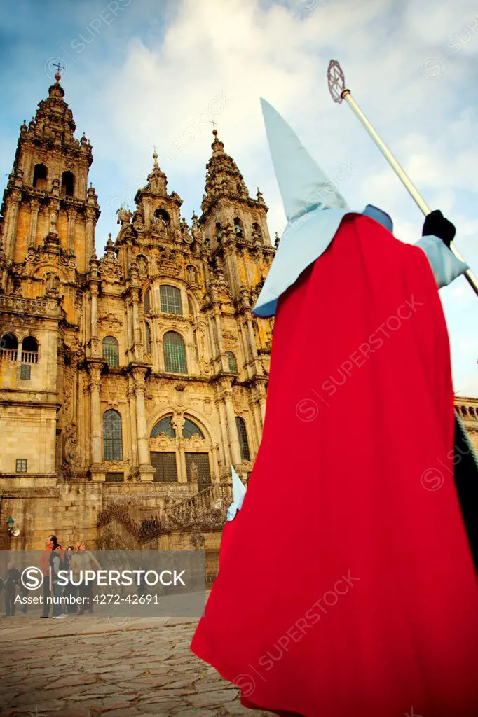 Santiago de Compostela, Galicia, Northern Spain, A nazareno walking in front of the Cathedral during Good Friday processions