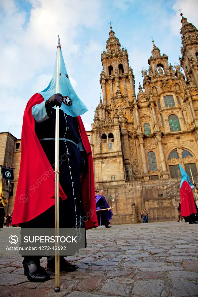 Santiago de Compostela, Galicia, Northern Spain, A nazareno walking in front of the Cathedral during Good Friday processions