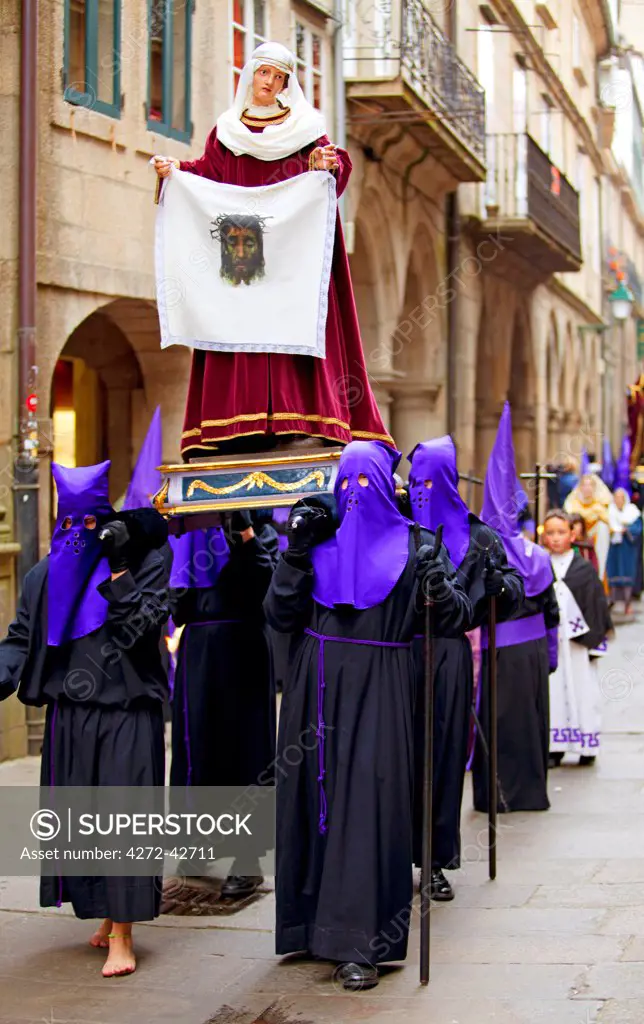 Santiago de Compostela, Galicia, Northern Spain, Nazarenos carrying statue during Semana Santa processions