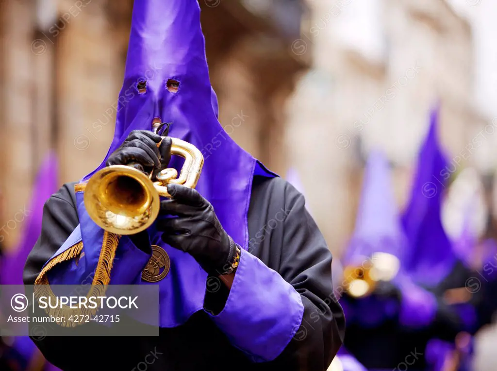 Santiago de Compostela, Galicia, Northern Spain. Detail of Nazareno playing a trumpet during Semana Santa processions