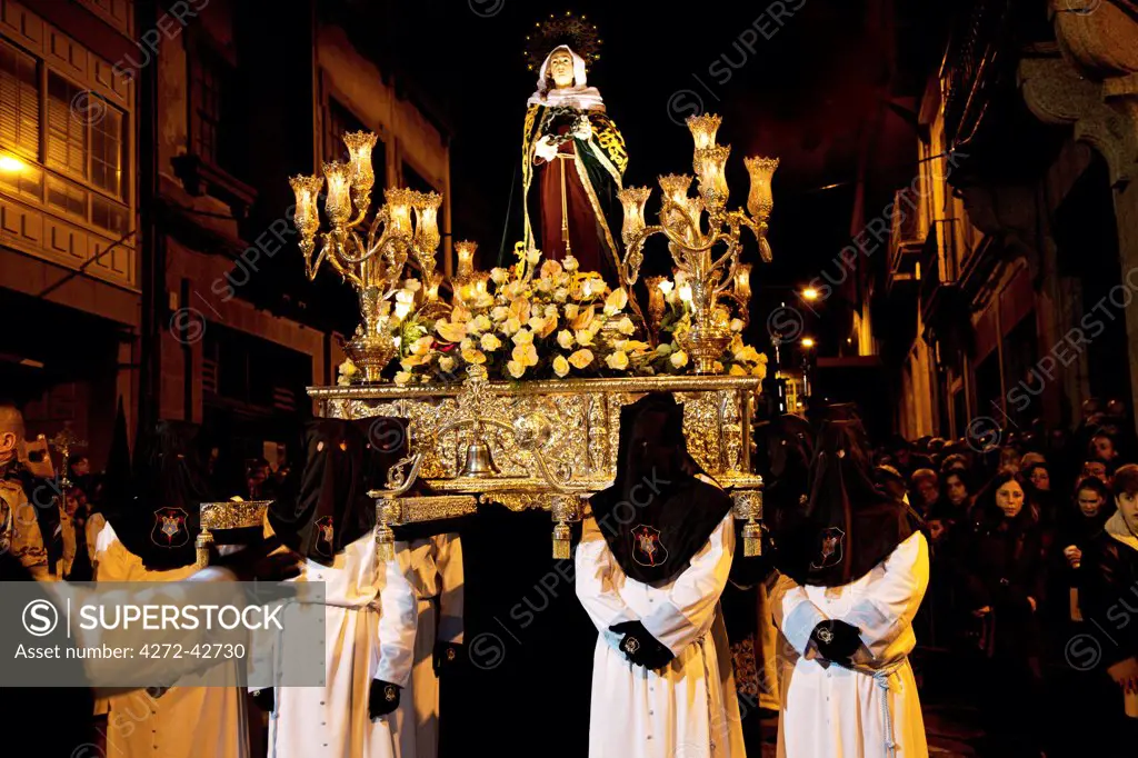 Santiago de Compostela, Galicia, Northern Spain, Nazareners carrying statue of the Madonna duing Semana Santa processions