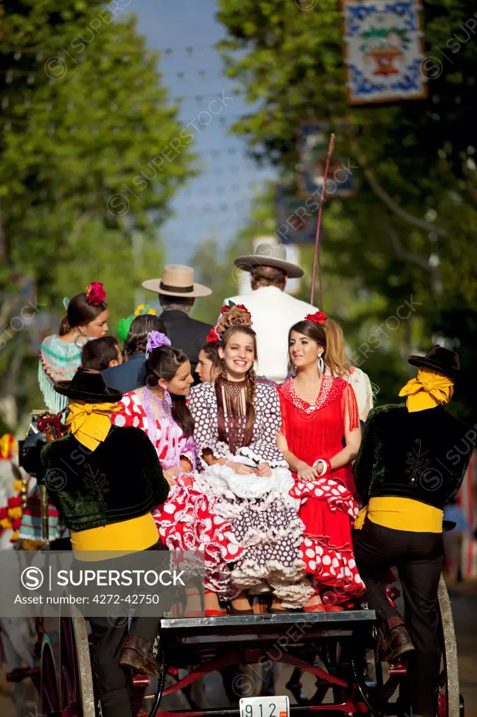 Seville, Andalusia, Spain, Young woman in a horse drawn carriage during the Feria de Abril