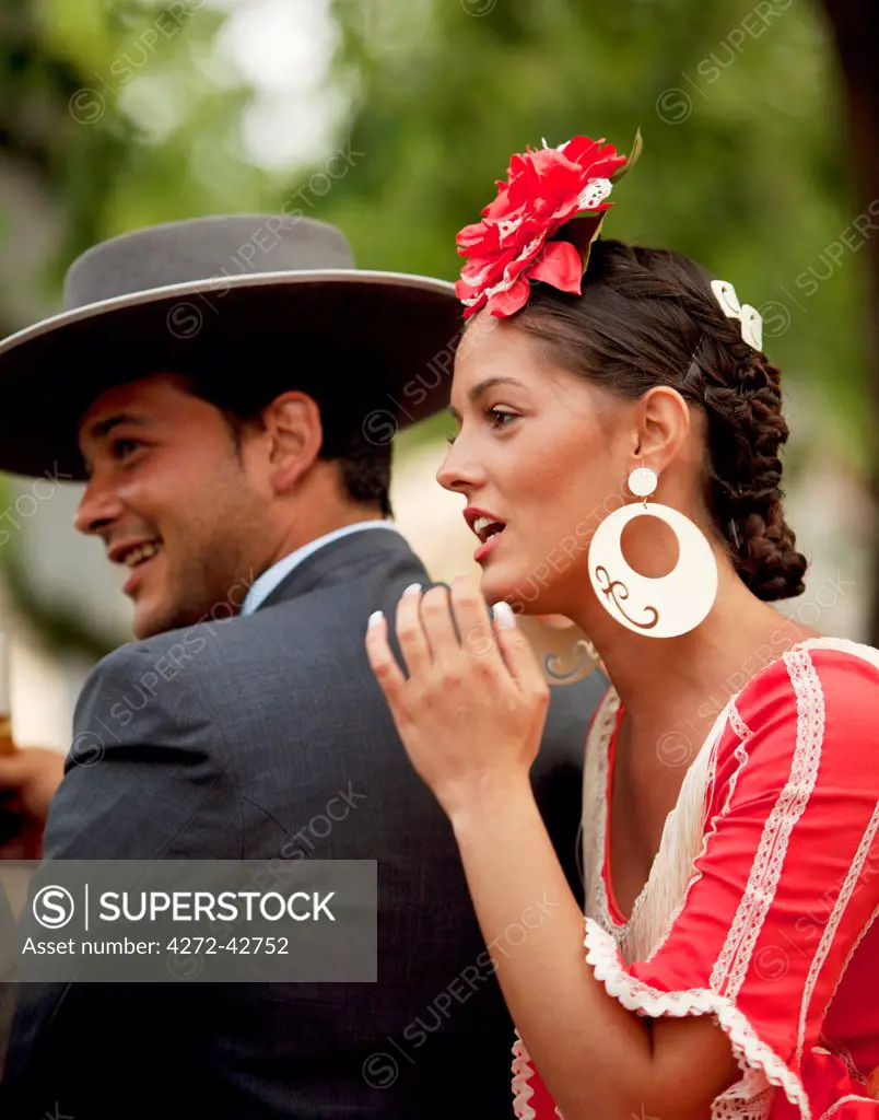 Seville, Andalusia, Spain, A young couple in traditinal clothes during the Feria de Abril