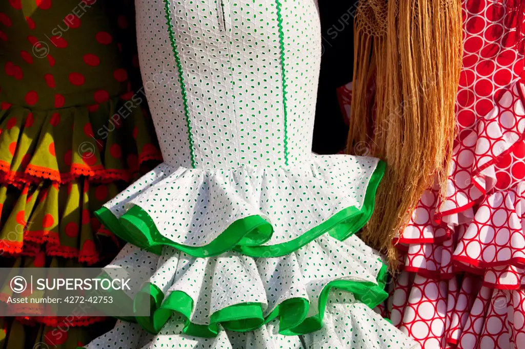 Seville, Andalusia, Spain, Detail of flamenco dresses worn by women during the Feria de Abril