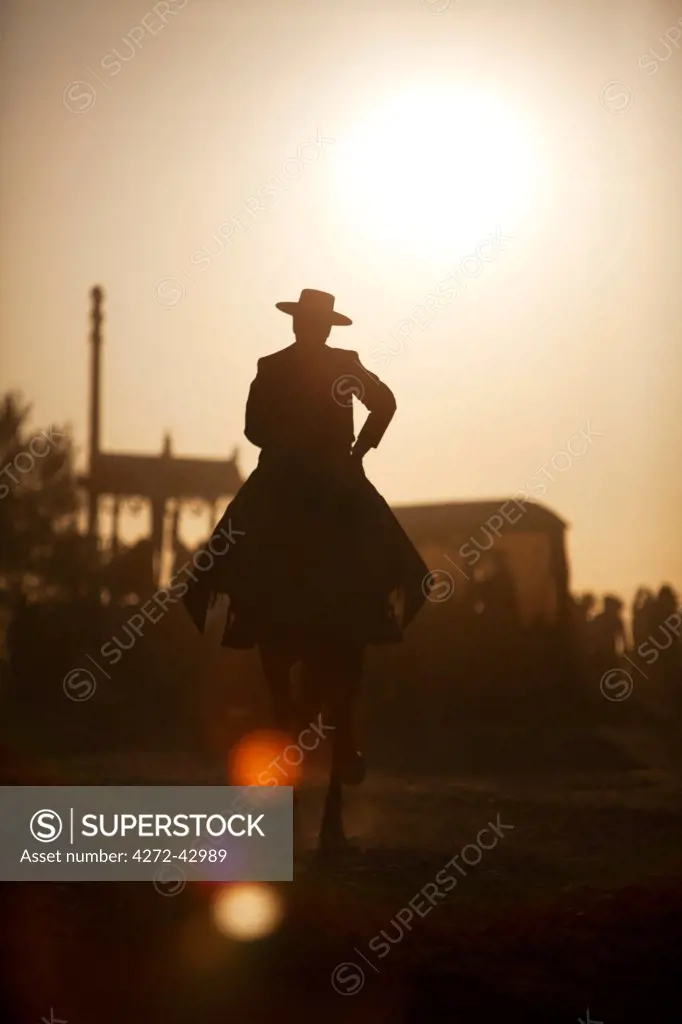 Seville, Andalusia, Huelva, Spain. Man in cowboy clothes during the El Rocio pilgrimage on the way to the village of El Rocio