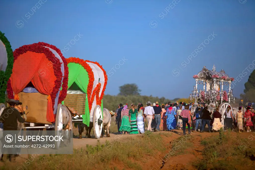 Seville, Andalusia, Spain. Colourful wagons on the way to the village of El Rocio during the El Rocio Pilgrimage