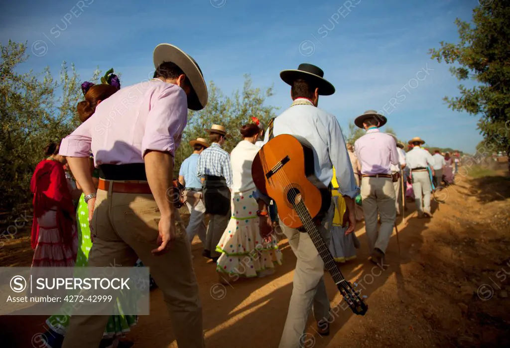 Seville, Andalusia, Spain. Pilgrims on the route to the village of El Rocio during the El Rocio pilgrimage