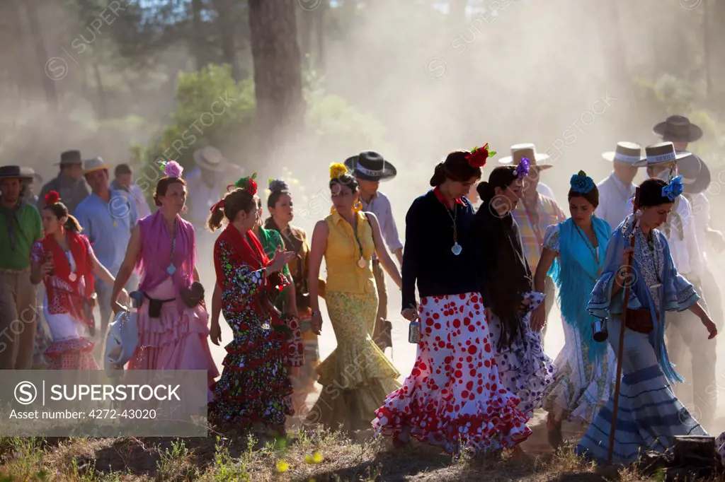 Huelva, Southern Spain. Pilgrims in traditional clothes walking on their way to the village of El Rocio during the annual Romeria