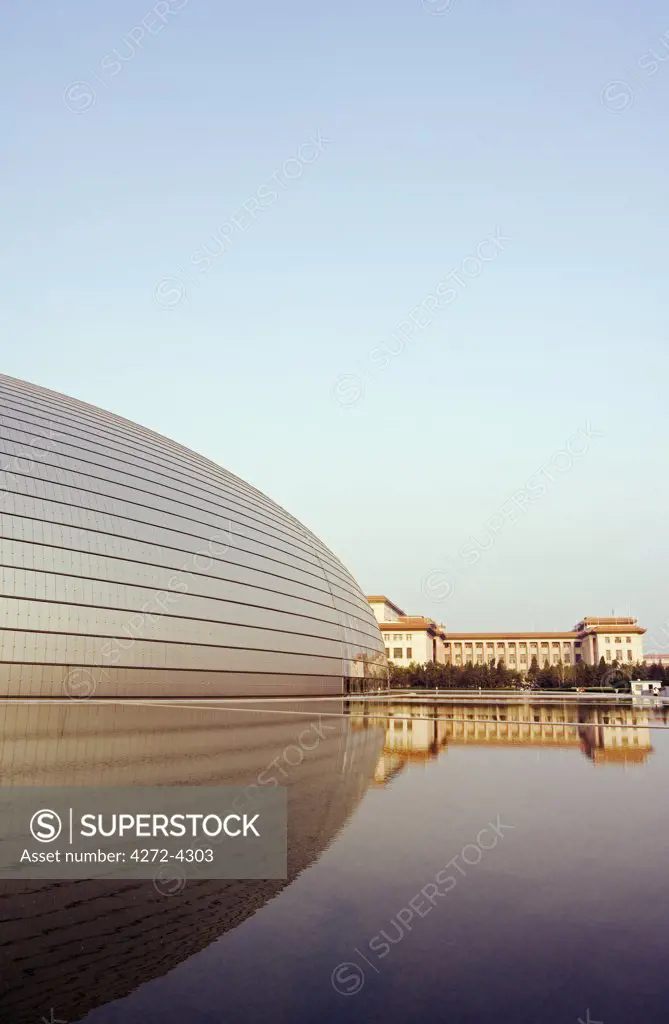 China, Beijing. The soviet style Great Hall of the People contrast with The National Grand Theatre Opera House also known as The Egg designed by French architect Paul Andreu and made with glass and titanium (opened Sept 25th 2007).