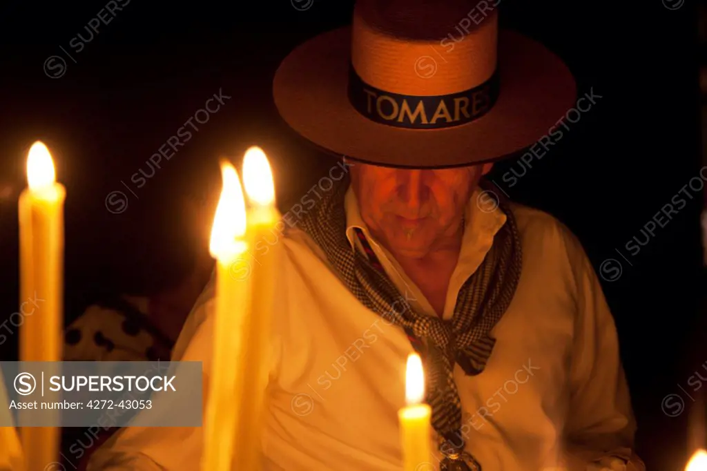 El Rocio, Huelva, Southern Spain; Believers lighting candles during the annual Romeria of El Rocio