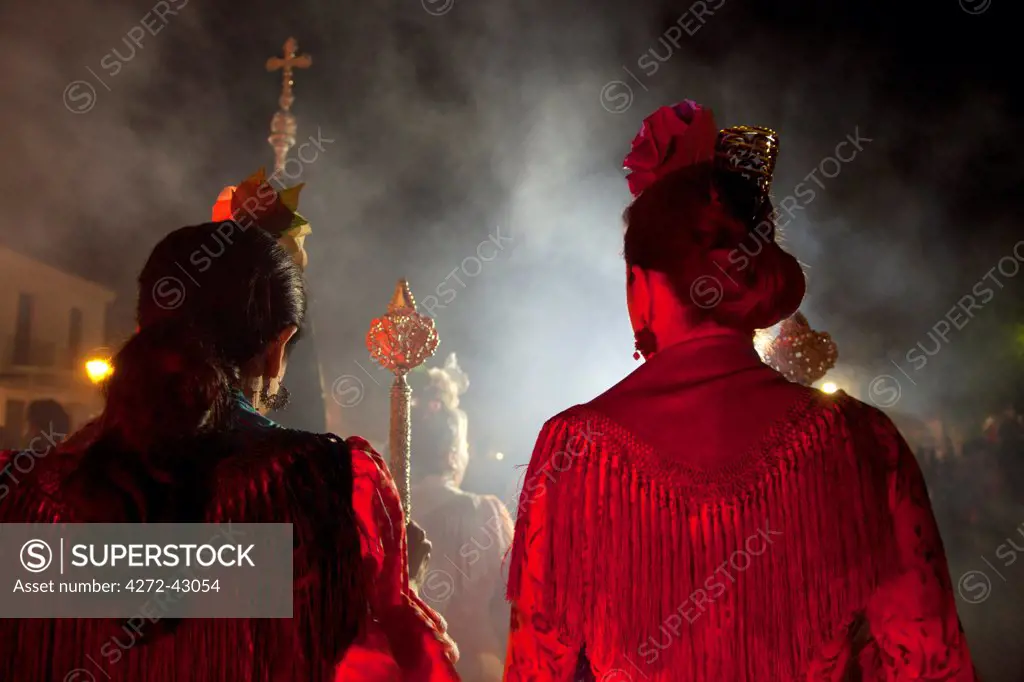 El Rocio, Huelva, Southern Spain. Women in traditional clothes participating in night celebrations on the eve of the feast of El Rocio