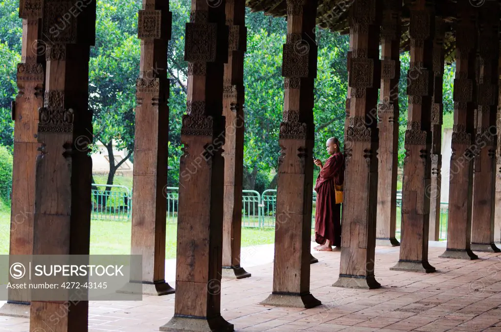 Sri Lanka, Sacred city of Kandy, UNESCO World Heritage Site, Temple of the Tooth, Sri Dalada Maligawa, monk making a phone call