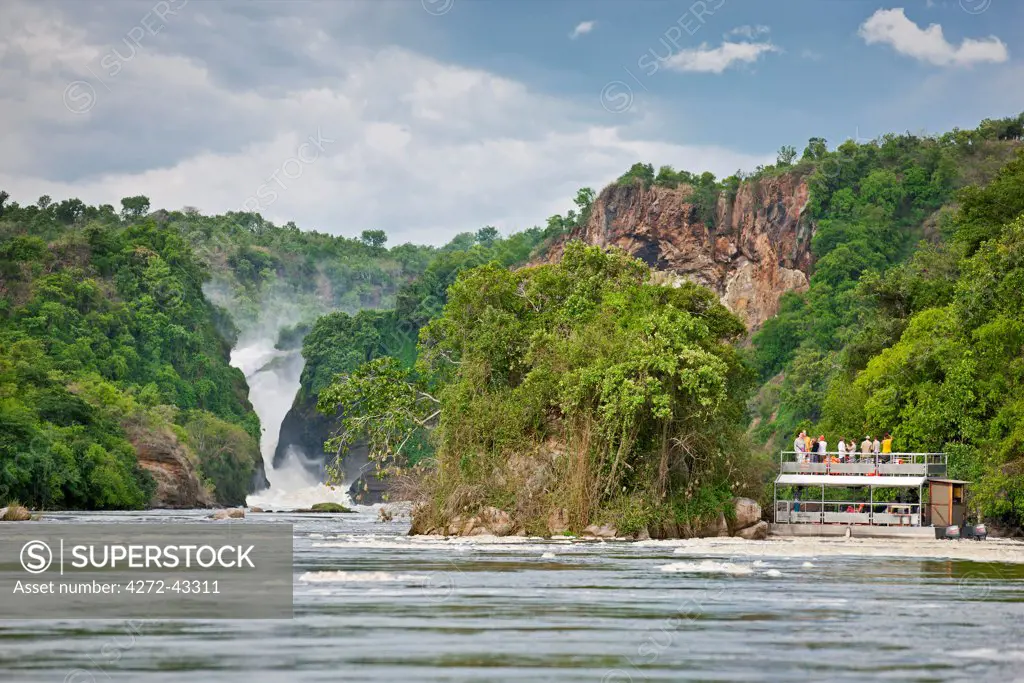 Tourists admire the spectacular Murchison Falls from the safety of a launch, Uganda, Africa